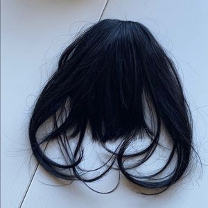 Black clip in bangs